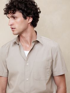 This shirt is cut from our new cotton poplin, one we love for its polished appearance and subtle sheen.  Each piece undergoes a special wash process to add a luxurious softness and an elevated-yet-casual look.  Standard fit.  Spread collar with button front.  Chest pockets.  Straight hem.  Standard fit.  Short sleeves.  Hip length.  Model: Size M, 6'2" (188cm). Summer Button-up Poplin Shirt, Summer Poplin Button-up Shirt, Summer Poplin Shirt With Relaxed Fit, Summer Poplin Shirt In Relaxed Fit, Summer Relaxed Fit Poplin Shirt, Classic Short Sleeve Shirt With Relaxed Fit, Classic Solid Short Sleeve Shirt With Relaxed Fit, Classic Short Sleeve Shirt With Spread Collar For Spring, Classic Short Sleeve Shirt With Spread Collar