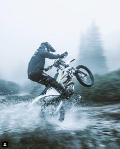 a man on a dirt bike in the water