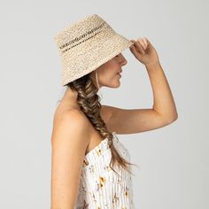 The temps are up and the style is on. Transform your look with our Woven Marled Bucket Hat. Crafted from premium 100% paper, this luxurious hat boasts a natural color and a brim size of 2.75". The ventilated crown and adjustable design make it the perfect fit. Elevate your style with this elegant and exclusive accessory. Features: Color: Natural Brim Size: 2.75" Hat Size : 57 cm , 22 1/2 inch Material: 100% Paper Ventilated Crown Adjustable Raffia Hat, Cold Drink, Day At The Beach, Brim Hat, Sunny Day, Hat Sizes, Sun Hats, At The Beach, Bucket Hat