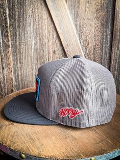 Grey mesh front and back, black/red patch 5-Panel trucker High-profile fit Hybrid bill Snapback, OSFA Flat Bill Trucker Hat For Sports, Sports Trucker Hat With Flat Bill, Sports Trucker Hat With Logo Patch, Trucker Snapback Hat With Flat Bill, Gray Trucker Hat With Flat Bill, Gray Flat Bill Trucker Hat, Trucker Snapback Hat For Sports, Gray Trucker Hat With Logo Patch, Mesh Trucker Snapback Hat For Baseball Season