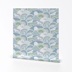 a blue and green wallpaper with an abstract pattern on it's side,