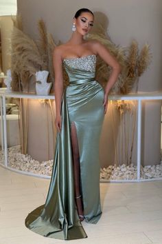 Feel beautiful and glamorous in this fashionable and eye-catching evening dress. This column dress features delicate beading and a satin finish, perfect for any special occasion. The sleeveless design will make you look and feel chic, showing off your natural beauty. Make a statement with this timeless design. Prom Dress Strapless, Sleeveless Prom Dress, Prom Dress Mermaid, Split Prom Dresses, Strapless Prom Dress, Homecoming Party, Dusty Sage, Strapless Prom Dresses, Dress Mermaid