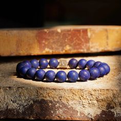 About Specifications Complete your outfit with our Lapis Lazuli Bracelet X (10mm). Handcrafted in The Netherlands by professional artisans with the best Nature has to offer and finished with 925 Sterling Silver. - Gems: Matte Lapis Lazuli- Stone size: 10mm - Metal: 925 Sterling silver - Cord: High-end durable silicone - Packaging: Comes with a luxurious box (Due to the unique characteristics of natural stone, the size and color of the beads can vary slightly.) Silicone Packaging, Multiple Bracelets, Best Nature, Lapis Lazuli Bracelet, Blue Lapis Lazuli, Lapis Lazuli Stone, Unique Characteristics, Blue Lapis, Bracelet Collection