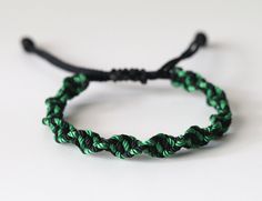 * This listing is for ONE black and green spiraled adjustable bracelet. * This checkered friendship bracelet is handwoven in Las Vegas, NV with black and green nylon cord. This can be worn as an everyday accessory, you can stack them with our other bracelets or with other accessories you own. This is a perfect affordable gift for your best friend, mother, father, sister, brother, or significant other Color: green and black Material: 1.8MM nylon cord Measurements: fits a 5 inch wrist UP TO a 9 1/2 inch wrist Closure: Adjustable Sliding Knot Shipping: Each bracelet is made to order. I usually can get your package out in 1-2 business days. I ship with USPS with tracking. Don't forget to follow our Instagram for updates on upcoming new collections, behind and scenes. https://www.instagram.com/ Checkered Friendship Bracelet, Adjustable String Bracelet, Sliding Knot, String Bracelet, Everyday Accessories, Affordable Gifts, Sister Brother, Braided Bracelets, Green And Black