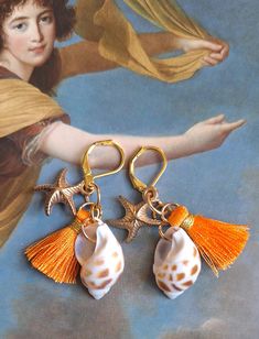 Unique baroque earring shell and orange tassels Real shell and gold metal star Total length: 7 cm Sent in a bubble envelope in letter followed, with an organza gift pouch. Thank you for your visit Beach Gold Tassel Earrings, Gold Dangle Tassel Earrings For The Beach, Gold Tassel Earrings For Beach, Orange Tassel Earrings Gift, Orange Beaded Tassel Earrings As Gift, Elegant Gold Tassel Earrings For Beach, Gold Tassel Earrings For Beach Summer, Gold Tassel Earrings For Beach In Summer, Elegant Orange Tassel Earrings For Gift