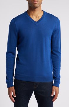 The only thing more wonderful than a smooth and polished-looking merino wool sweater is the fact that it's washable—your life just got easier! 28" length (size Medium) V-neck Ribbed cuffs and hem 100% merino wool Machine wash, dry flat Imported Men's Clothing Blue V-neck Fine Knit Sweater, Blue Cashmere V-neck Sweater, Blue Merino Wool Fine Knit Sweater, Blue V-neck Cashmere Sweater, Blue Fine Knit Merino Wool Top, Fine Knit Merino Wool Blue Top, Blue Fine Knit Merino Wool Sweater, Blue Fine Knit V-neck Sweater, Classic Blue V-neck Sweater For Work