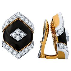 These beautiful and unique earrings from David Webb feature a black onyx center accented by approximately 0.75 carat total weight in round diamonds. They are set in 18 karat yellow gold and platinum with a clip on style back. The MSRP is approximately $21,000. These earrings are from the Manhattan Minimalism collection and are circa 1970. Condition: Excellent. No visible signs of wear. Luxury Black Diamond Earrings, Luxury Black Diamond Earrings For Formal Occasions, Luxury Black Diamond Earrings For Anniversary, Luxury Black Earrings With Polished Finish, Luxury Black Diamond Earrings For Evening, Black Diamond Earrings With Accents For Formal Events, Black Diamond Earrings With Accents For Formal Occasions, Formal Black Diamond Earrings, Classic Black Diamond Earrings For Formal Occasions