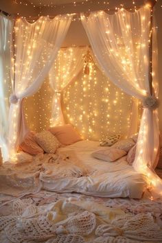 a bed with lights hanging from the ceiling and curtains over it's headboard