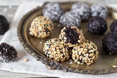 chocolate covered cookies and nuts on a plate