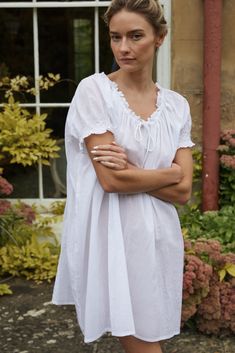 A family business, If Only If is obsessed with the classic nightgown from its timeless silhouette to the most special details. Crafted in 100% natural materials, these nightdresses are romantic, practical, and become even softer with every wash. Crafted from soft cotton, the Clover Smocked Cotton Voile Nightdress is made specially for those sultry summer nights. Featuring an adjustable drawstring neckline, and hand-smocked cap sleeves, it's a warm weather dream come true. Product Details 100% GO Linen Nightgown, Cotton Night Dress, Cotton Nighties, White Nightgown, Drawstring Neckline, Cotton Nightgown, Cotton Sleepwear, Farm Girl, Capped Sleeve Dress