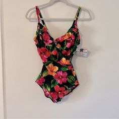 Adjustable Straps Cross Front With Ruffles At Bust Scoop Back Fitted Tropical Tankini With V-neck, Fitted One-piece Tropical Tankini, Fitted Pink Tankini With Lined Body, Pink Fitted Lined Tankini, Fitted Pink Lined Tankini, Fitted Pink Bodysuit For Vacation, Fitted Lined Bodysuit For Vacation, Pink Fitted Tropical Bodysuit, Fitted Tropical Pink Bodysuit