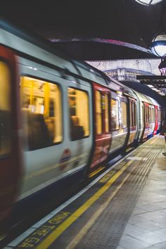 a subway train is coming down the tracks