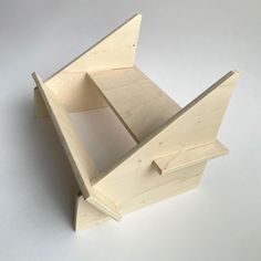 a wooden box that is open on a white surface