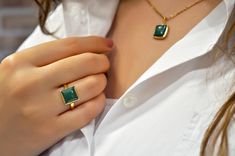 Noble, feminine, special ... Extraordinary, square ring with a green colored jade gemstone in a gold-plated 925 sterling silver setting. The geometric shaped ring gives your outfit the perfect addition. The jade healing stone ensures harmony and balance. You can also give the ring away to your loved ones. It is well suited as a Mother's Day present, as a birthday present or as a Christmas present. Of course, you can also give yourself a present! If you would like to combine this piece of jewelery with suitable earrings and necklace you can find them under the following links: https://www.etsy.com/de/listing/1098150310/925-sterling-silber-jade-ohrringe-grun?ref=listings_manager_grid https://www.etsy.com/de/listing/1112082999/925-sterling-silber-kette-mit?ref=listings_manager_grid - Size: ad Modern Emerald Cut May Birthstone Jewelry, Modern Green Emerald-cut Jewelry, Modern Gold Plated Square Jewelry, Modern Jewelry With Rectangular May Birthstone, Modern Rectangular May Birthstone Jewelry, Green Princess Cut 14k Gold Jewelry, Modern Yellow Gold Jade Jewelry, Green Rectangular Fine Jewelry, Elegant Gold Plated Square Jewelry