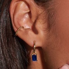 Unleash your inner elegance with our Iris Sapphire Hoops. Crafted with rich sapphire stones and shaped like a lock, these 14K gold-plated earrings add a pop of exquisite color and a unique charm to your ensemble.  Sapphire is also known as September birthstones.  14k gold plated over sterling silver.  Hypoallergenic, nickel, and lead-free. Tarnish resistant. H2O sensitive. Recommend taking them off during shower and storing in the pouch that comes with the package. Baguette Hoop Earrings, Sapphire Stones, September Birthstone Jewelry, August Birthstone Jewelry, July Birthstone Jewelry, Zodiac Jewelry, Jewelry Ring Box, Earrings Small, Pearl Jewellery Earrings