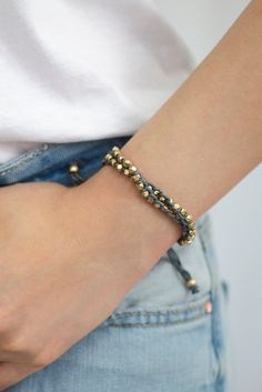 a close up of a person wearing a bracelet