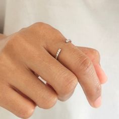 Our Silver Ana Ring is the perfect minimalist stacking ring. It features a thin open band with tiny round CZ crystals at the opening of the band. It's the perfect dainty ring for a minimal statement look and can be worn alone or stacked with other rings. We make our jewellery in small batches to reduce wastage. Our jewellery is designed with the modern Woman in mind, elegant, unique pieces with a classic touch. Our jewellery is great for gifting, whether it's Valentines, Mothers Day, Birthday or Open Diamond Ring, Band Gifts, Diamond Ring Band, Rings Minimalist, Silver Ring Band, Zierlicher Ring, Gold And Silver Rings, Silver Stacking Rings, Message Jewelry