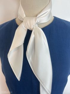 "Plain white natural mulberry silk medium square scarf, size: 65 cm x 65 cm / 26 in x 26 in. Soft, smooth, and lustrous silk charmeuse fabric, breathable and skin-friendly feels very soft and comfortable to wear. Can wear it on both sides which will give different feel and look. Can style in many ways: can wear this scarf as a soft neck scarf, as a hair tie, as a headband scarf, as a wrist scarf, as a purse accessory. Or style it in any way you want with your own sense of creativity! Suitable for all seasons and is a great gift idea for special occasions.  Care Instructions: Pure silk is a type of organic, natural and delicate fabric, please avoid washing if it's not particularly dirty. Gently hand wash cold/lukewarm with mild detergent, natural air dry. Stored in a cool, dry, and dark pla Elegant Solid Color Handkerchiefs For Gifts, Elegant Spring Square Silk Scarf, Elegant White Handkerchiefs As Gift, Elegant White Square Silk Scarf, Elegant White Handkerchiefs Gift, Classic Silk Scarf For Spring, Elegant Silk Scarf With Satin Finish For Summer, Elegant Spring Silk Scarf With Satin Finish, Classic Spring Scarves For Formal Occasions