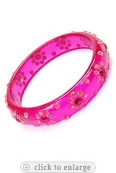 I am offering you this vintage rare dimensional   intense pink colored  Lucite bangle bracelet  with inset  colored  rhinestones. There is such fantastic color saturation in these stones, and the sparkle and light play is magnificent off this  bracelet !!  It measures app.  2   1/2  inches in diameter, and it is app.  1/2   inch wide.   The wonderful era of plastics is back,  all the rage now The Lucites, Bakelite's , and Celluloids are so in now, and really evoke an era that is so very highly s Pink Rhinestone Bangle Bracelets, Pink Rhinestone Bangle Bracelet, Pink Rhinestone Party Bracelets, Pink Jeweled Bangle Bracelets, Pink Jeweled Bangle Bracelet, Pink Crystal Bangle For Party, Lucite Bracelets, Bangle Bracelet, Favorite Jewelry