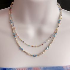 Gorgeous Brand New Multicolored Blue Toned Beaded Bohemian Layered Necklace With Silver Hardware And An Adjustable Chain. Super Dainty And Cute. Has Little Star Silver Beads And Other Ceramic Ones As Well Summer Blue Necklaces With Spacer Beads, Handmade Silver Beaded Necklaces For Summer, Handmade Silver Beaded Necklace For Summer, Blue Jewelry With Silver Beads For Summer, Blue Beaded Necklaces With Spacer Beads For Summer, Light Blue Beaded Necklaces With Round Beads For Summer, Blue Beaded Necklace With Spacer Beads For Summer, Blue Beaded Chain Jewelry For Summer, Summer Blue Beaded Chain Jewelry