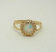 Opal ring / Opal jewellery / Blue opal ring / Gold Filled opal ring / Dainty ring . White opal ring / October birthstone ring Ring features: - Opal measures 8mm - All components are 100% gold filled / sterling silver Gold filled is an actual layer of gold-pressure bonded to another metal. Gold filled is not to be confused with gold plating as filled literally has 100% more gold than gold plating. Gold filled is much more valuable and tarnish resistant. It does not flake off, rub off or turn colo White Opal Birthstone Ring, Opal Birthstone Ring As A Gift, Gold Round Cut Opal Ring, Round Opal Ring For Gift, Opal Birthstone Ring Round Cut, White Opal Ring With Round Stone, Opal Birthstone Ring For Anniversary, Opal Round Band Ring For Gift, Yellow Gold Opal Birthstone Ring