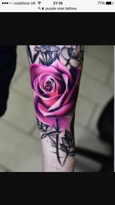 a person with a rose tattoo on their leg and the bottom half of his arm