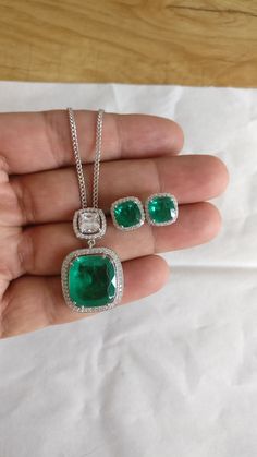 "Classic necklace & earrings set made using Emerald Doublets cushion shape cut stone and best AAA quality Zircons. Metal used is Silver 925 and is real platinum plated to enhance the life and look of jewelry. Necklace chain has length adjustment options from 16\" to 18\" inches. We have used Emerald Doublet cushion shape cut which looks exactly like real Colombian Emerald. Doublet is nothing more than a natural stone glued to a cheaper stone. The advantage of creating a doublet over selling a sy Sterling Silver Jewelry With Cushion Diamond Cut, Sterling Silver Jewelry With Diamond Cushion Cut, Formal Cushion Cut Hallmarked Jewelry, Luxury Emerald Square Pendant Necklace As Gift, Sterling Silver Cushion Cut Diamond Jewelry, Silver Cushion Cut Jewelry With Matching Earrings, Cushion Cut Cubic Zirconia Jewelry Gift, Cubic Zirconia Cushion Cut Jewelry Gift, Silver Cushion Cut Gemstone Jewelry