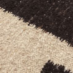 an area rug with black and white colors