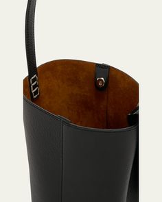 JW Anderson "Corner" bucket bag in grain calf leather     Shoulder strap with oversized chainlink hardware, 8.7" drop    Open top with magnetic closure     Lining: Suede    Approx. 7.9"H x 5.9"W x 5.5"D    Made in Hungary Rectangular Textured Leather Bucket Bag For Work, Luxury Bucket Shape Shoulder Bag For Work, Leather Bucket Bag With Smooth Grain For Office, Textured Leather Crossbody Bucket Bag For Work, Calf Leather Bucket Bag With Smooth Grain, Classic Calf Leather Bucket Bag For Business, Workwear Textured Leather Bucket Bag Crossbody, Classic Leather Bucket Bag With Metal Hardware, Leather Top Handle Bucket Bag With Smooth Grain