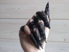 "BLACK FINGER CLAWS \"SYL\" Black Filigree Claw Rings connected with chains. All claws and rings are fully adjustable. Available in Silver, Black, Bronze and Gold Tone. More colors here: https://www.etsy.com/listing/588788847/nail-finger-claws-syl-halloween-hand - The set of 10 finger armors is always 10% off compared to the set of 5. NOTE: This design is also available for MALE hands, the only difference is that the chains are longer than the standard design. If you need longer chains just add Goth Wedding Jewelry, Nail Claws, Claw Rings, Metal Glove, Black Fingers, Vampire Jewelry, Black Claws, Halloween Ring, Double Rings