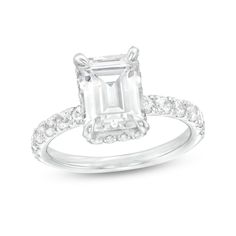 Indulge the one you love with the sophisticated sparkle of this emerald-cut lab-created diamond engagement ring in white gold. Fashioned in 14K white gold The 3 ct. certified emerald-cut lab-created diamond boasts a color rank of I and clarity of Si2. A hidden halo of round lab-created diamonds wraps the center stone while additional lab-created diamonds shimmer along the shank. Includes certification card This engagement ring shines with 3-7/8 cts. t.w. of lab-created diamonds. White Emerald Cut Dazzling Diamond Ring, Dazzling White Emerald-cut Diamond Ring, Dazzling White Emerald Cut Diamond Ring, Dazzling Emerald Cut Diamond Ring For Proposal, Emerald Cut Diamond Ring With Accents For Proposal, White Emerald-cut Lab Grown Diamond Ring, White Emerald Cut Lab Grown Diamond Ring, Fine Jewelry Emerald Cut Lab Grown Diamond Ring, Wedding Emerald Ring With Vvs Clarity And Square Cut