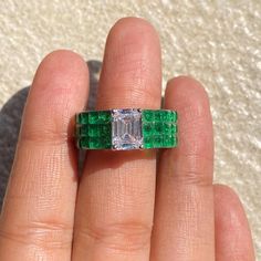 Emerald ring featuring semi precious green stone and cz diamonds in an invisible setting. Ideal to pair with your formals to special occasion outfits. Perfect Gift for her. *𝐏𝐑𝐎𝐃𝐔𝐂𝐓 𝐃𝐄𝐓𝐀𝐈𝐋* * 𝐌𝐚𝐭𝐞𝐫𝐢𝐚𝐥: Brass * 𝐏𝐥𝐚𝐭𝐢𝐧𝐠: White Rhodium Plated * 𝐒𝐭𝐨𝐧𝐞: AAA-quality CZ Diamond & Emerald. *𝐃𝐈𝐌𝐄𝐍𝐒𝐈𝐎𝐍𝐒* * 𝐖𝐞𝐢𝐠𝐡𝐭: 6 gm * 𝐖𝐢𝐝𝐭𝐡: 0.8 Inch * 𝐒𝐢𝐳𝐞: 5.5  fits upto 6 𝐕𝐢𝐬𝐢𝐭 𝐎𝐮𝐫 𝐅𝐀𝐐𝐬 𝐟𝐨𝐫 𝐒𝐡𝐢𝐩𝐩𝐢𝐧𝐠 𝐏𝐨𝐥𝐢𝐜𝐢𝐞𝐬 𝐚𝐧𝐝 𝐂𝐚𝐫𝐞 �𝐈𝐧 Ring Bride, Emerald Band Ring, Bride Wedding Gift, Luxury Green, Emerald Band, Ring Luxury, Wide Band Ring, Emerald Diamond Ring, Wedding Gifts For Bride