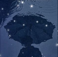 an umbrella is reflected in the water on a rainy night with stars and bubbles above it