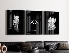 two black and white pictures hanging on the wall above a couch in a living room