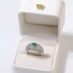 Featuring a heart-shaped emerald centerpiece surrounded by a dazzling halo of diamonds, this delicate ring embodies the essence of vintage elegance. The rich green color of emeralds symbolizes love and vitality, while sparkling diamonds add a touch of glamor. Metal: Recycled Sterling Silver Gemstone: Cubic Zirconia Ring Diameter: 10mm Weight: 7g Emerald And Diamond Ring, Edison Pearls, Vintage Elegance, Rich Green, Cubic Zirconia Rings, Vintage Heart, Emerald Gemstone, Delicate Rings, Recycled Sterling Silver