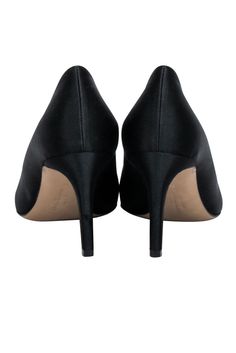 Step out in style with these Ferragamo pumps! In a sleek black satin material with a pointed toe and bow front, they'll pair perfectly with a fancy party dress. Your feet will be ready for any social season event! Size 8 Made in Italy Satin upper Leather lining and sole Black and gunmetal bow toe detail Pointed toe Minor blemishes on heel Heel height 3" Black Pumps With 4-inch Heel For Evening, Black Evening Pump With 4-inch Heel, Round Toe Heels With Satin Bow For Evening, Evening Heels With Satin Bow And Round Toe, Fitted Heels With Satin Bow And Round Toe, Satin Heels With Satin Bow And Round Toe, Fitted High Heels With Satin Bow, Fitted Satin Bow Heels With Round Toe, Fitted Satin Bow High Heels