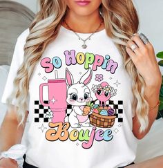 So Hoppin Boujee Checkered Bunny Cup (Tee) T-Shirt | Easter Fashion | Unique Gifts for Family Friends   Hop on by and check out our Easter t-shirt collection, where festive charm meets comfort in every stitch! Embrace the spirit of the season with our range of delightfully designed tees, featuring whimsical Easter motifs and vibrant colors that capture the essence of springtime joy. Crafted from premium materials for maximum coziness, these t-shirts are perfect for egg hunts, family gatherings, or simply adding a touch of seasonal flair to your everyday ensemble. Browse our collection now and elevate your Easter wardrobe with style and charm today!   Key Features: High-Quality Material: Made from the softest washed, garment-dyed, and durable fabric, this T-shirt is built to last and keep y Cute Plaid Short Sleeve Tops, Cute Short Sleeve Plaid Tops, Easter Motifs, Easter Themes, Easter Fashion, Easter T Shirts, Bunny Designs, Fashion Unique, Shirt Collection