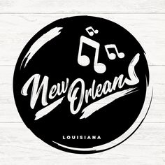 the new orleans logo is shown on a white wooden background with black and white lettering