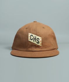 Our CHS Embroidered Charleston hat features hand embroidered and woven patch details, a perfectly worn in feel, front and back woven patch details, and adjustable brass buckle clasp.Made from washed 100% cotton twill fabricFabric strap with adjustable brass buckle claspDue to the handmade nature of this design items may have slight variations Pre-washed Cotton 5-panel Hat, Vintage Adjustable Dad Hat With Short Brim, Retro Adjustable Dad Hat With Embroidered Logo, Retro Cotton Snapback Hat For Outdoor, Cotton Snapback Hat, Vintage Canvas Baseball Cap, Vintage Snapback Hat With Embroidered Logo And Curved Brim, Vintage Cotton Snapback Hat With Short Brim, Retro Cotton Hats For Outdoor