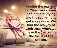 a present wrapped in red string with the words, finding the real joy of christmas comes not in the hurrying and the worrying