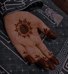 a person's hand with henna on it