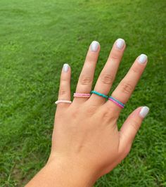 These simple rings are made with seed beads and are available in sizes 5-12! They stackable or they can be worn as just one! Please choose your size and color from the drop down buttons. If you have any questions please feel free to contact me! Adjustable Multicolor Rings With Tiny Beads, Minimalist Everyday Beaded Rings, Minimalist Adjustable Pink Stackable Rings, Adjustable Beaded Rings For Promise, Adjustable White Rings With Tiny Beads, Adjustable Beaded Stackable Rings, Adjustable Beaded Promise Rings, Seed Bead Rings, Bead Rings