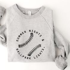 a sweatshirt with the words, summer nights and baseball lights printed on it