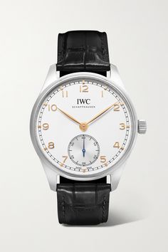 IWC SCHAFFHAUSEN's first 'Portugieser' model debuted in the 1930s and became an instant classic - today, the sophisticated and steamlined 40.4mm design is just as eye-catching as ever. This timepiece has a broad stainless steel case that houses a clear silver-plated dial and signature seconds dial at 6 o'clock. It's kept by the manufacturer's own 82200-calibre automatic movement and boasts an impressive 60-hour power reserve. The black alligator strap is another timeless detail.  All IWC SCHAFF… Iwc Perpetual Calendar, Iwc Chronograph, Iwc Schaffhausen, Iwc Pilot, Black Alligator, Iwc Watches, Fine Watches, O Clock, Watches Jewelry