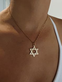 Celebrate your Jewish identity with this beautiful 14K yellow gold Magen David necklace. Jewish pride doesn't go out of style and neither does this classic necklace. Symbolic Gold Plated Necklace With Polished Finish, 14k Gold Tarnish Resistant Chain Necklace, Classic Yellow Gold Charm Necklace With Clavicle Chain, Classic Yellow Gold Clavicle Chain Charm Necklace, 14k Yellow Gold Necklace With Clavicle Chain, 14k Yellow Gold Clavicle Chain Necklace, Minimalist 14k Gold Star Of David Necklace, 14k Gold Pendant Necklace, Tarnish Resistant, Classic 14k Gold Pendant Chain Necklace