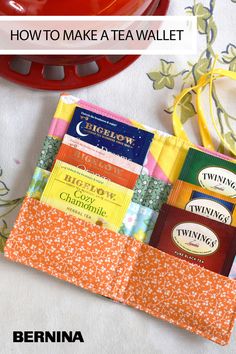 an orange and white table cloth with some tea bags on it, and the words how to make a tea wallet