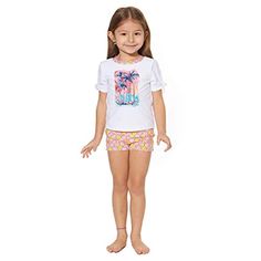 Two Piece Short Sleeve Rash Guard Set Has Tile Print Upf 50+ 82% Nylon, 18% Elastase Lining 100% Polyester Stretch Short Sleeve Beach Set, Playful Beach Sets With Stretch, Summer Swimming Sets With Short Sleeves, Playful White Short Sleeve Swimwear, Playful White Shorts For Poolside, Playful Short Tops For Playwear, Short Sleeve Cotton Swimwear For Play, Cotton Playwear Sets For Beach Season, Short Sleeve Swimwear For Beach Play