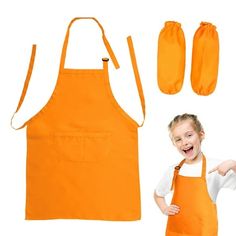 a child wearing an orange bib and apron with two mitts next to it