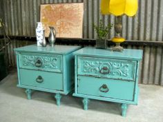 two blue nightstands sitting next to each other