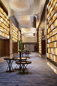 an empty library with many bookshelves and tables